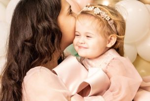 mother embracing daughter
