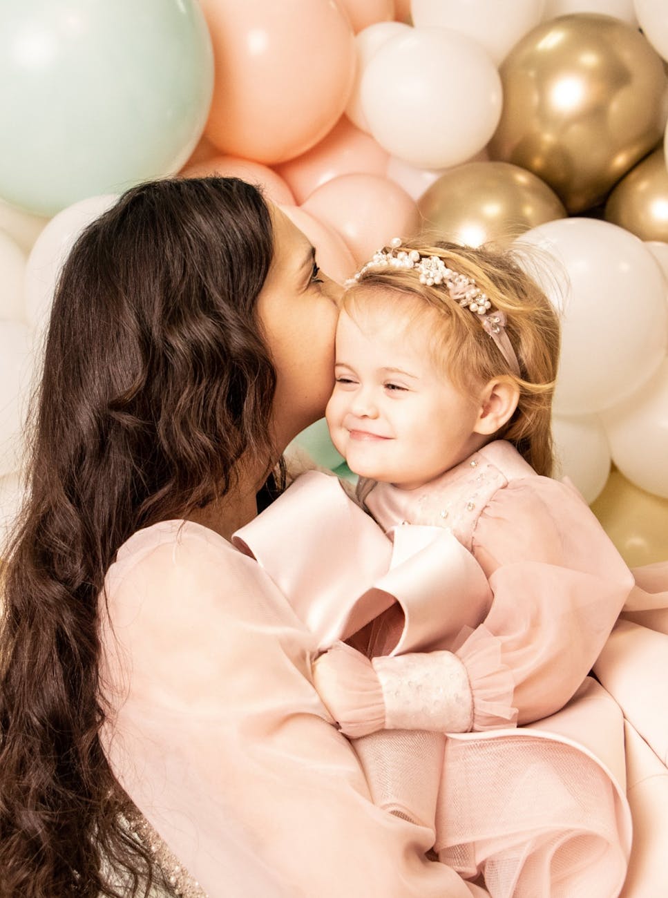 mother embracing daughter