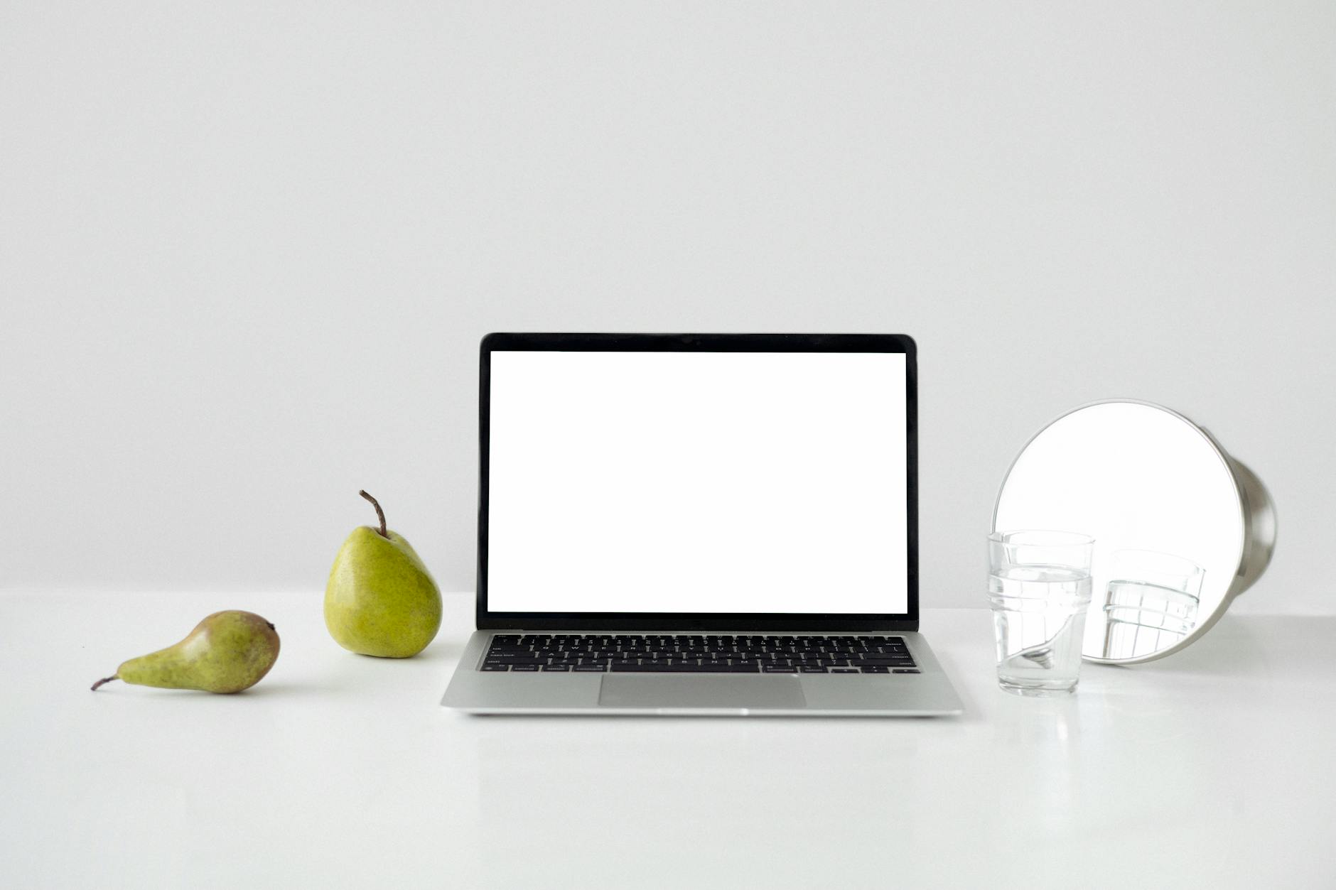 macbook pro on white table