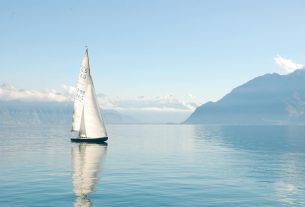 white sailboat on water